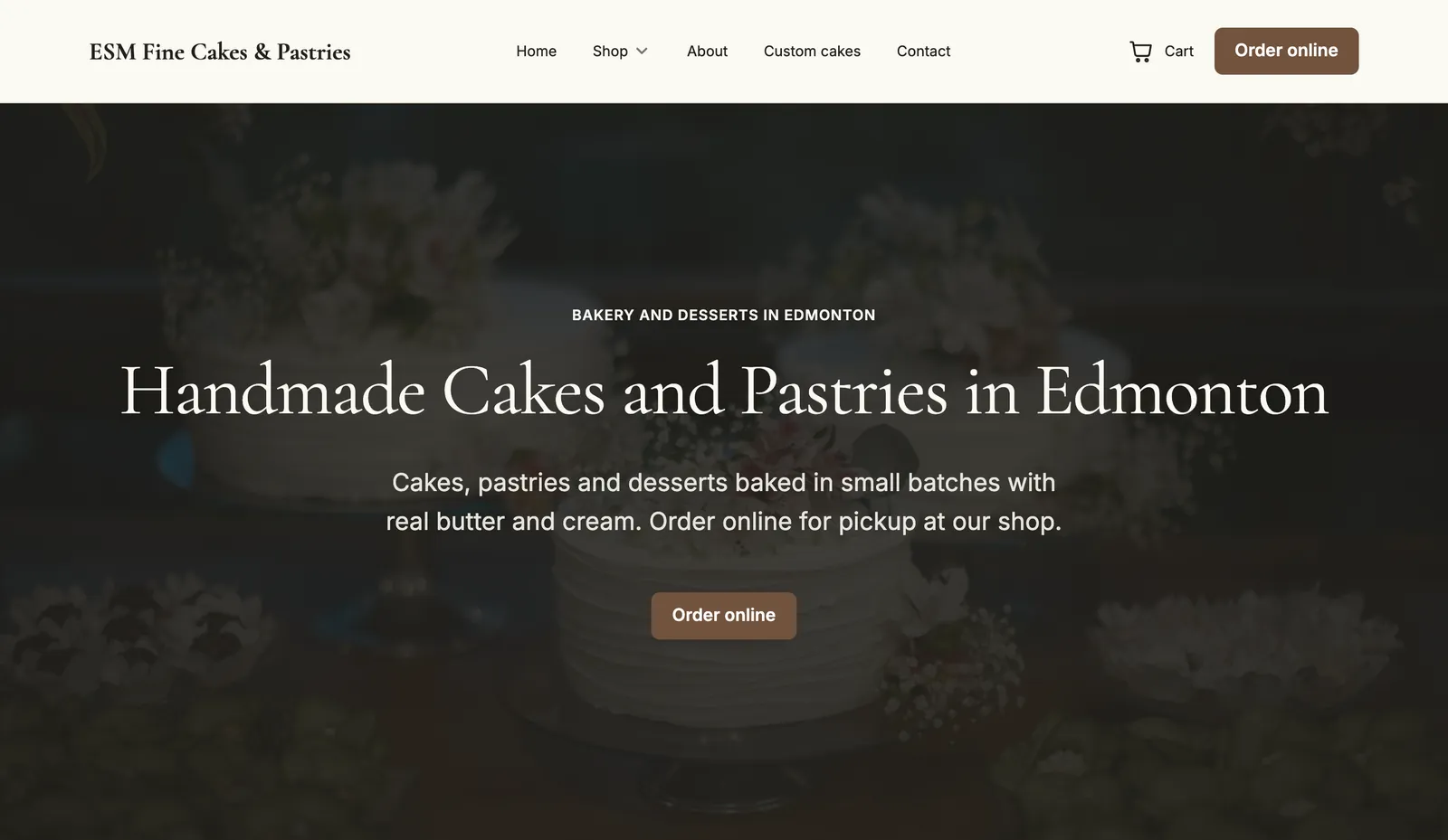 The home page of a bakery's website made with Mainmark: handmade cakes and pastries, over a photograph of decorated cakes, with an Order online button